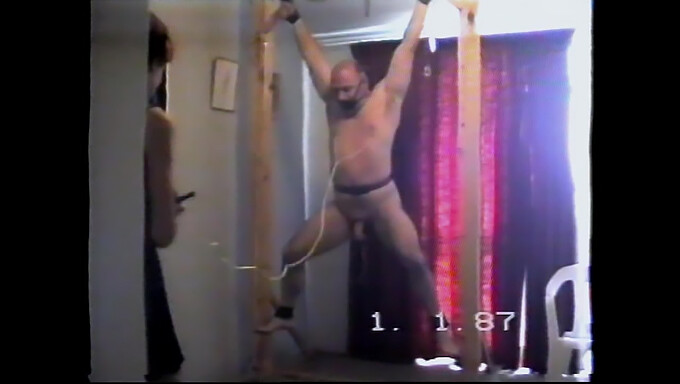 A Slave In European Bondage Being Whipped